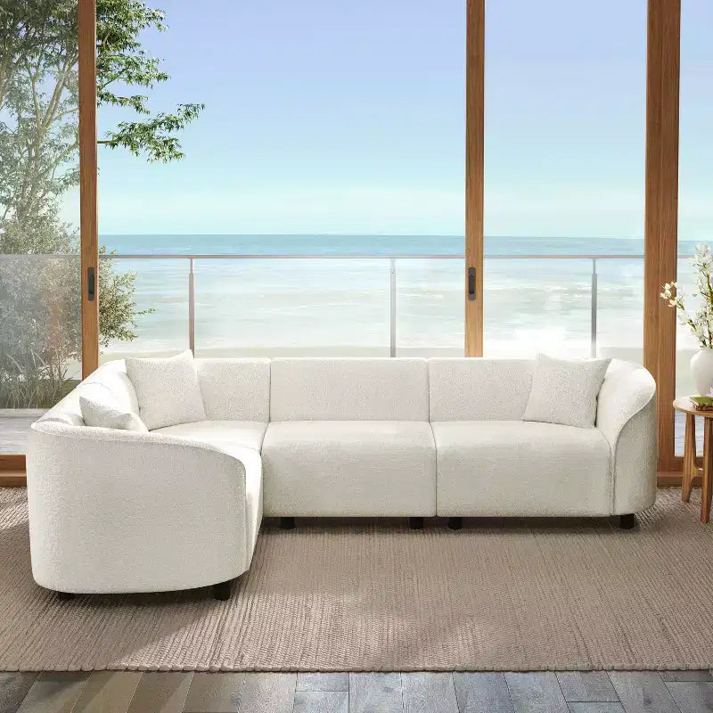 Divano sezionale a L curvo in bouclé beige a 4 posti Isolde Contemporary da 104"